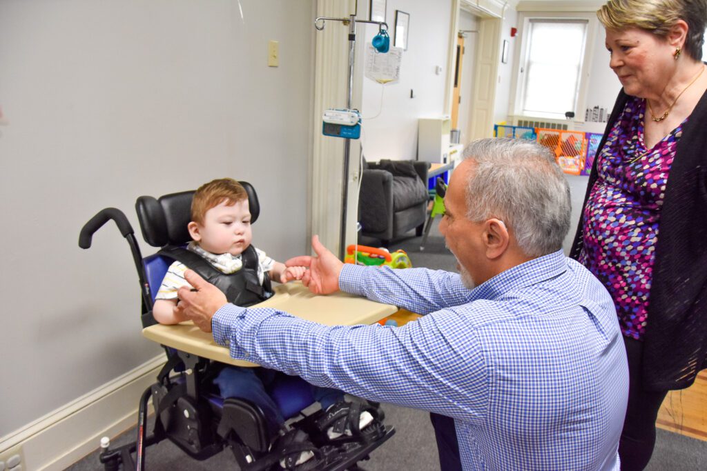 Dr. Chris Cianci and Ginny Craig with a child from KenCrest's Transitional Homes for Medically Fragile Children. // Photos by Aubrey Crompton. 