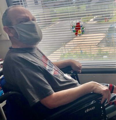 Pete in his power chair // Photo courtesy of Julie Daly